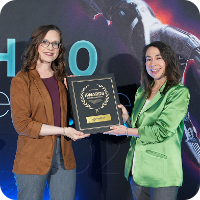 Healthcare leader being recognized on stage